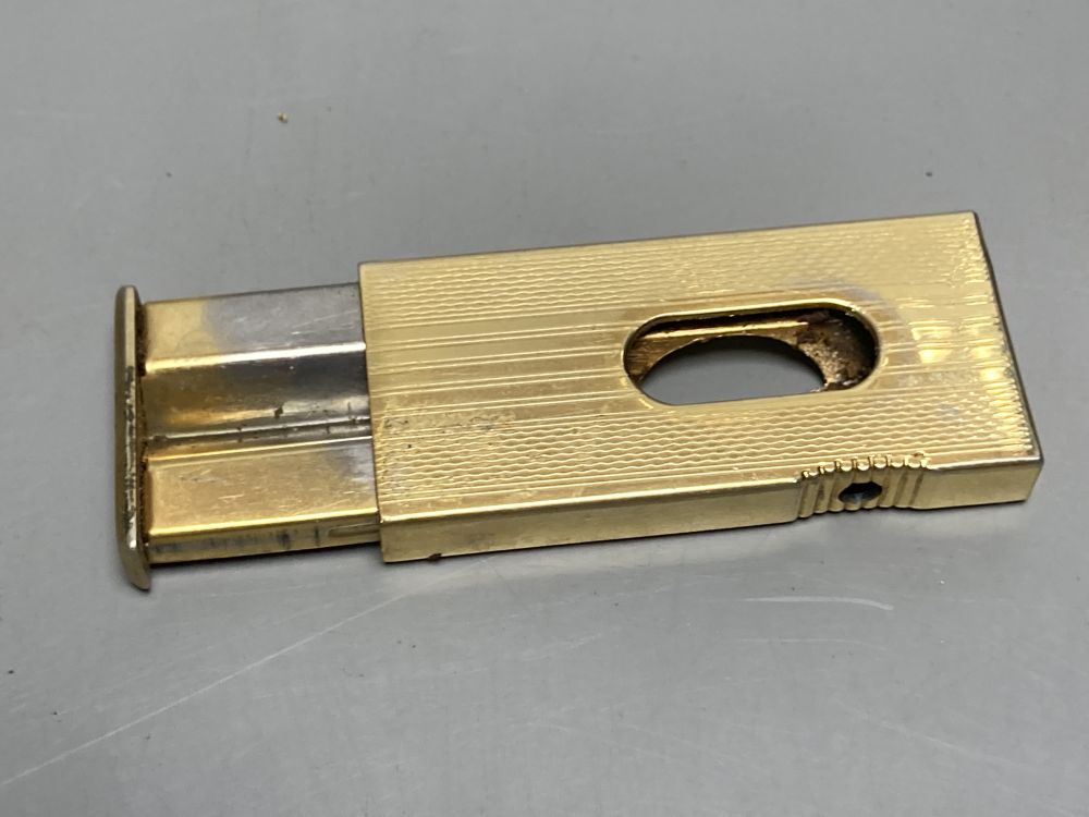 A gold plated Dunhill lighter no. A50077 and a German Dominus cigar cutter